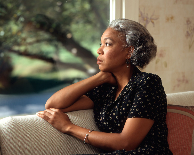 17071-an-african-american-woman-looking-out-a-window-pv