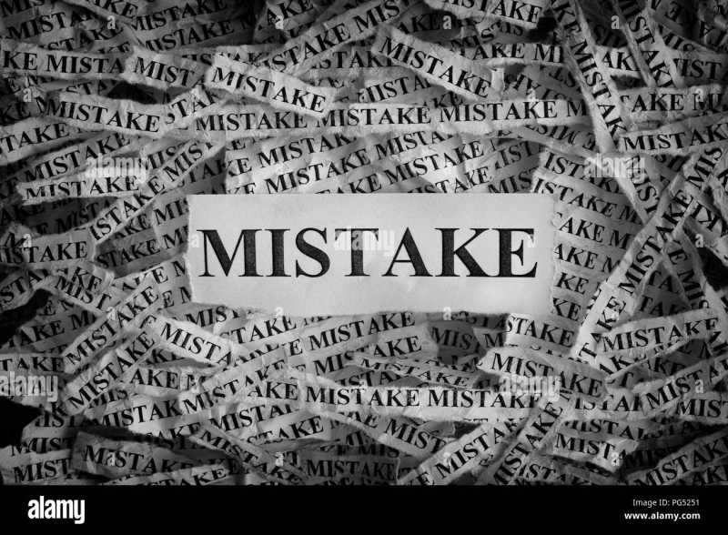 Mistake-torn-pieces-of-paper-with-the-word-mistake-concept-image-black-and-white-closeup-PG5251-715276043